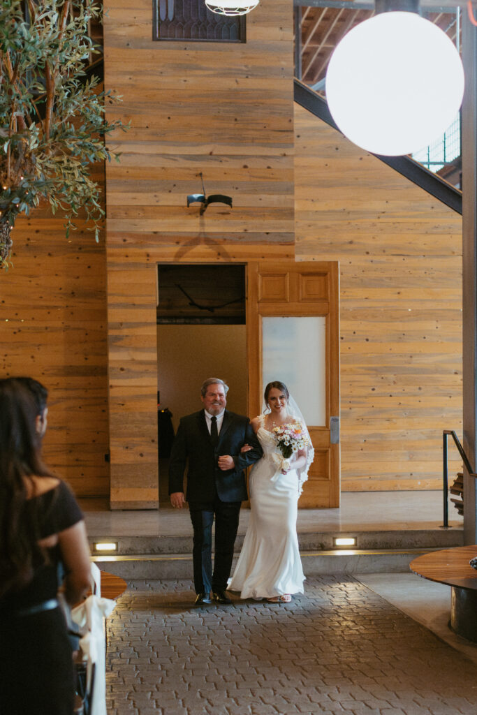 San Diego Wedding photographer photographs couples ceremony at the downtown industrial venue 808. 