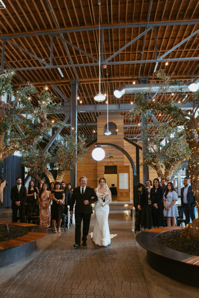 San Diego Wedding photographer photographs couples ceremony at the downtown industrial venue 808. 