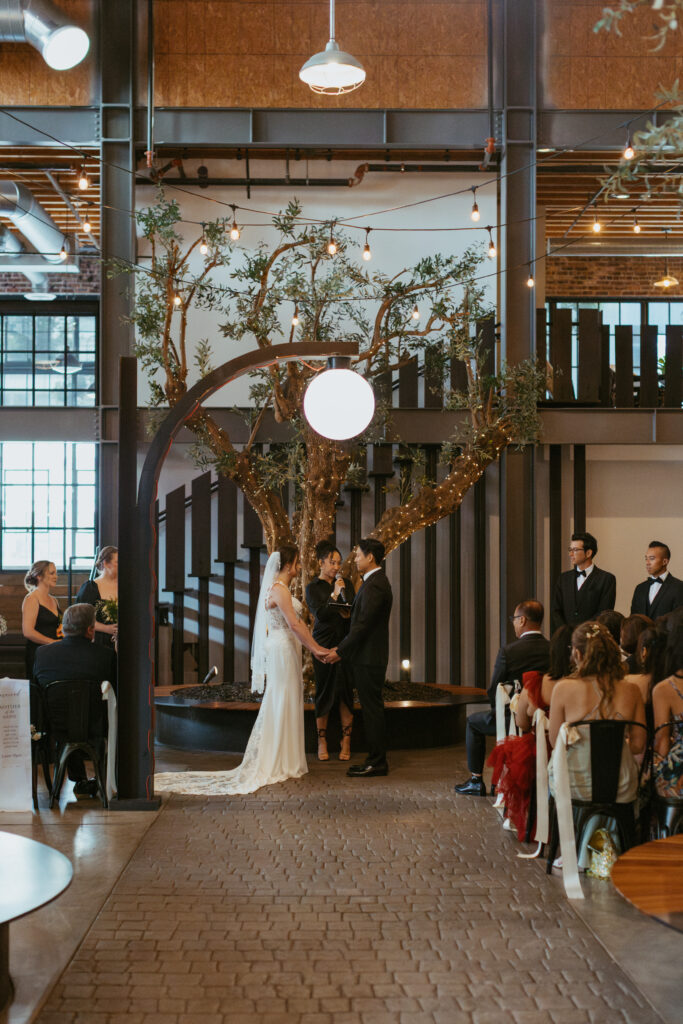 San Diego Wedding photographer photographs couples ceremony at the downtown industrial venue 808. 