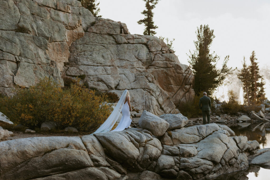 couples first look moment at Whitney Portal Lake. This Yosemite Elopement photographer was there to capture it.