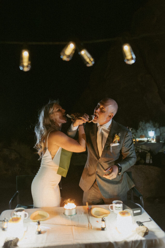 Couple Exchanges Smores in the Desert at their Desert Elopement in California.