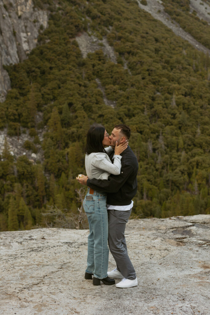Man proposing on one knee to woman at Tunnel View Yosemite