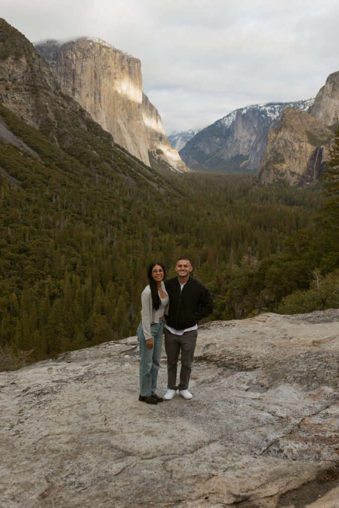 Man proposing on one knee to woman at Tunnel View Yosemite, Surprise proposal at Tunnel View Yosemite