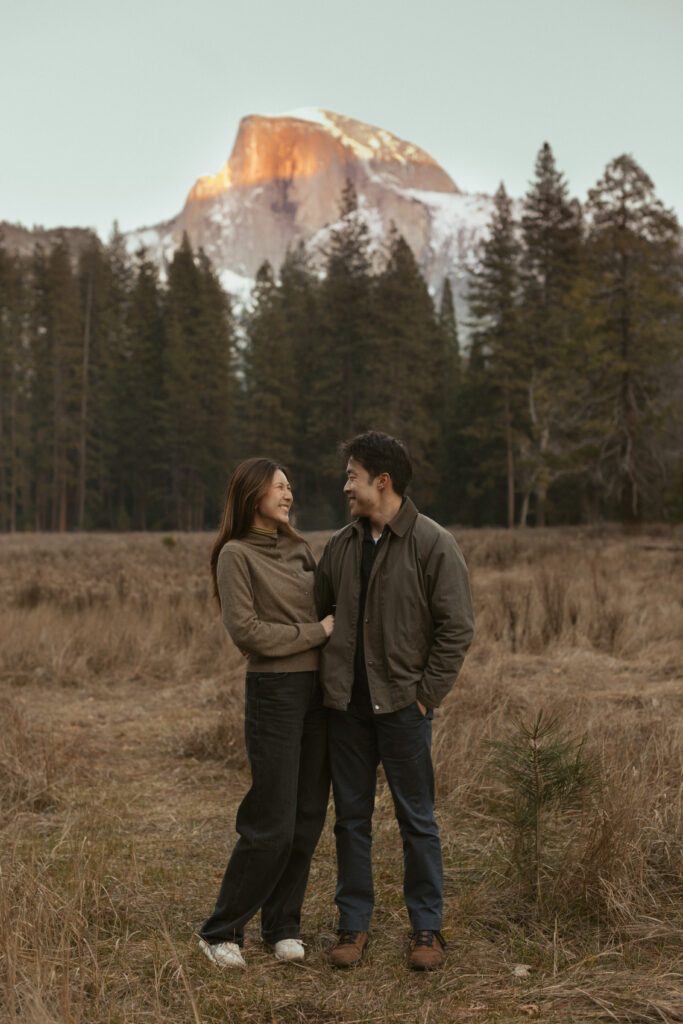 Intimate Yosemite engagement photos in Cooks Meadow after surprise proposal with winter light in Yosemite Valley.