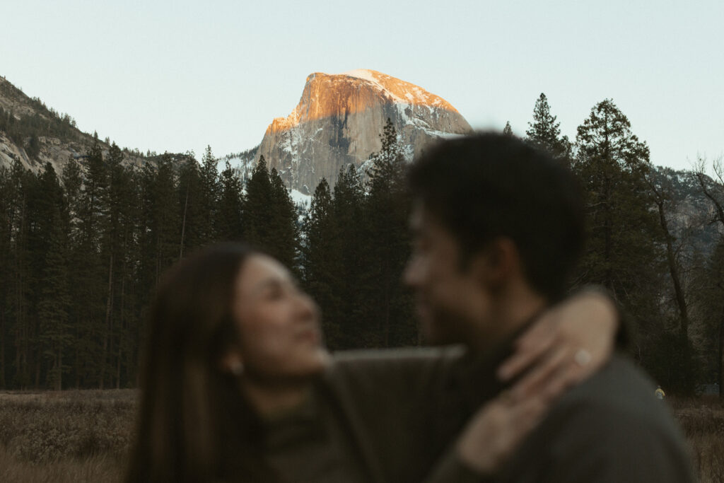 Intimate Yosemite engagement photos in Cooks Meadow after surprise proposal with winter light in Yosemite Valley.
