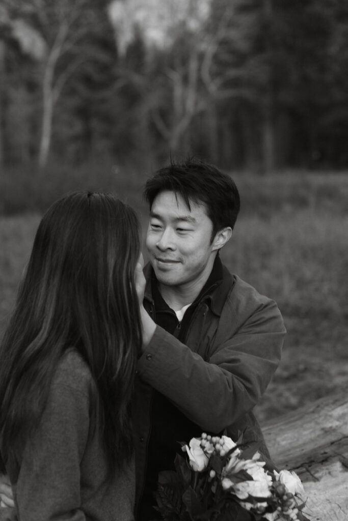 Intimate Yosemite engagement photos in Cooks Meadow after surprise proposal with winter light in Yosemite Valley.