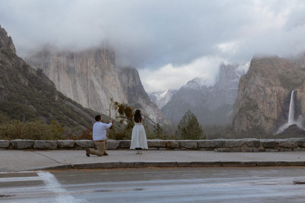 Yosemite Park Photographer takes photos of a couple getting engaged at Tunnel View 