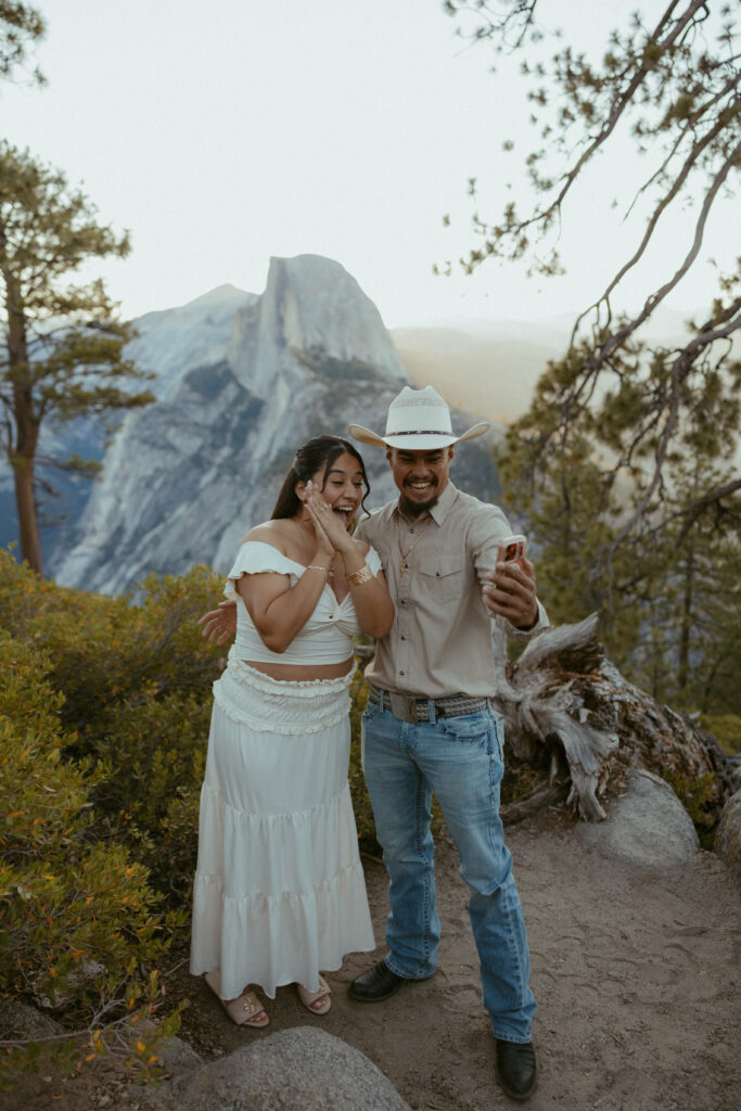 A couple Face times Friends and Family after they get engaged on a national Park 