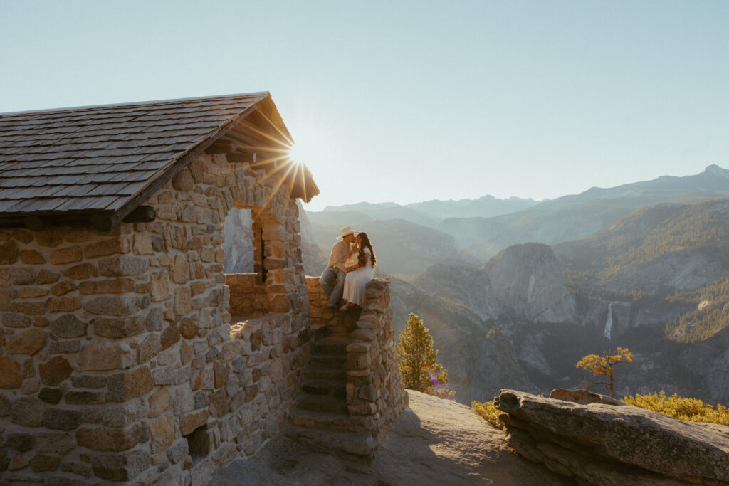 A couple sits at the Geology Hut in Glacier point after they Got engaged in a National Park 
